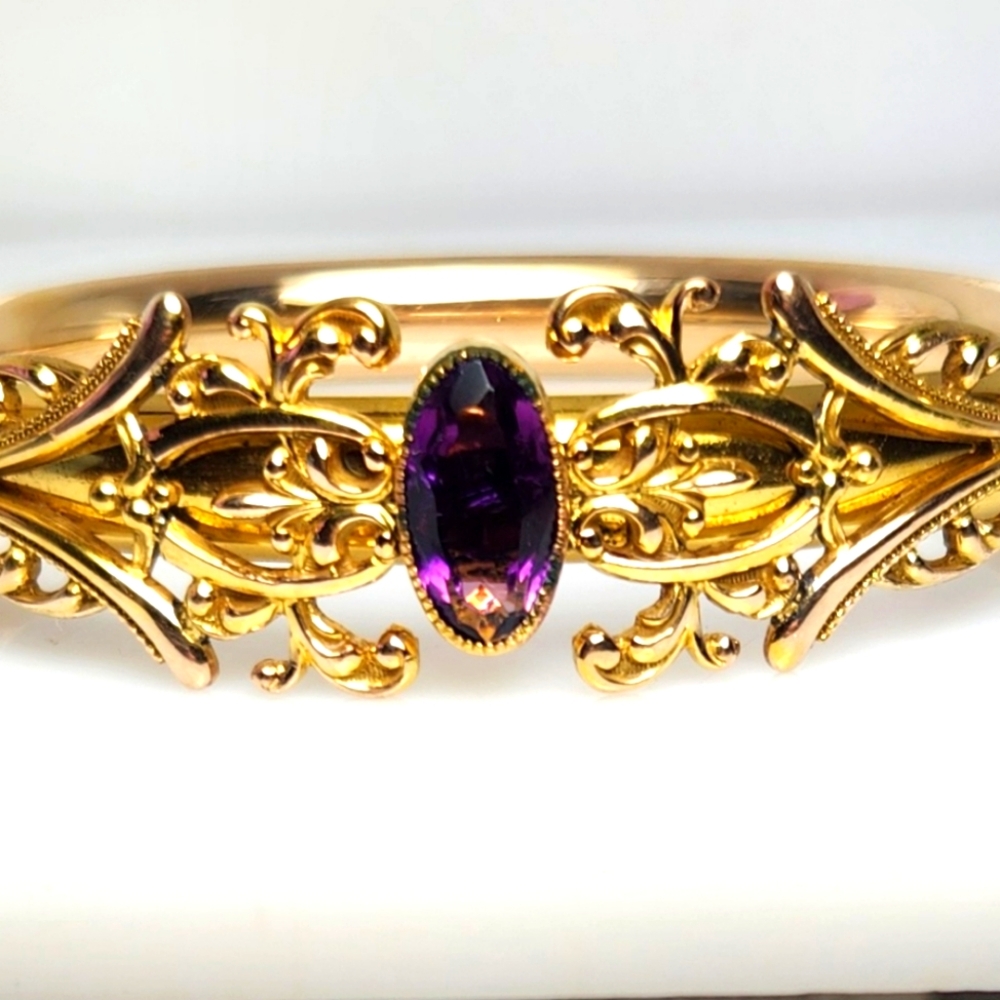 14k yellow gold vintage bangle with purple stone